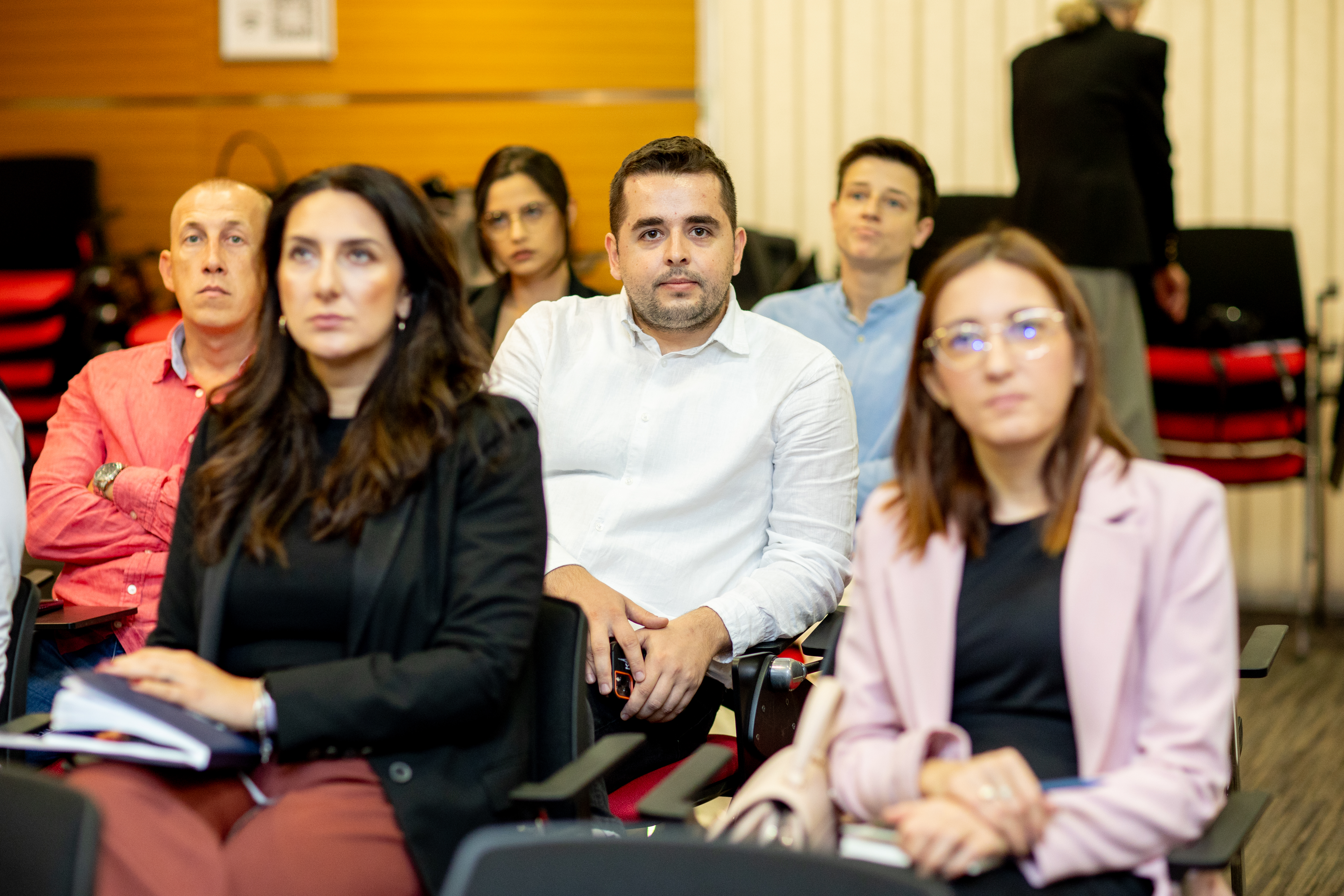 Workshop participants engaging with AI technology demonstrations